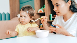 a mom trying to feed her picky eating toddler