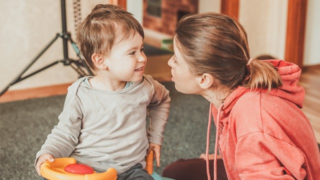 a toddler working with a speech language pathologist