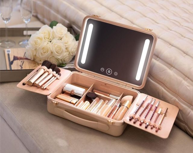 light up smart makeup box open on a dressing table