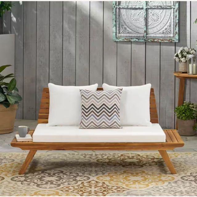 teakwood outdoor loveseat with white cushions