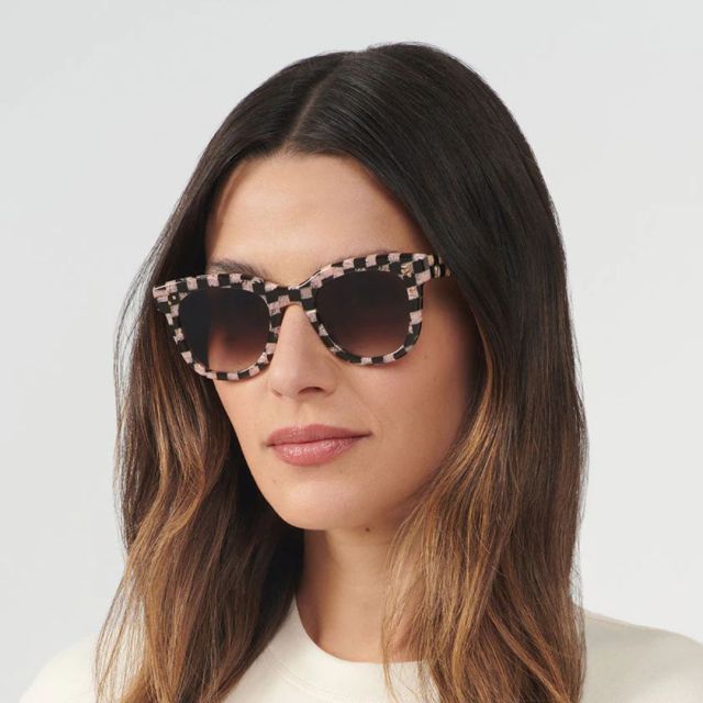 woman wearing checked sunglasses