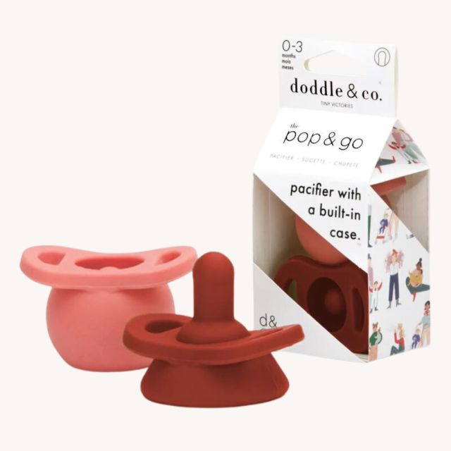 red and pink doodle & co baby pacifiers
