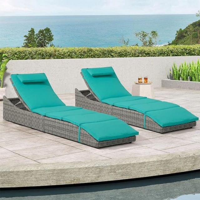 set of two turquoise lounge chairs poolside