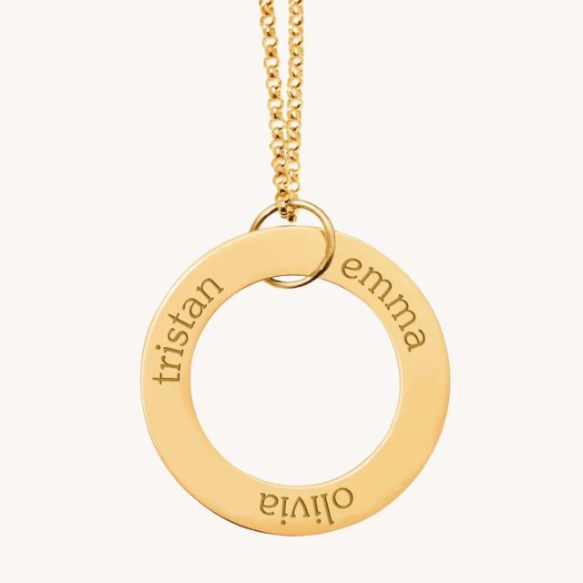 gold circle necklace with 3 names engraved on it