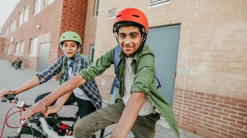 two boys on bikes