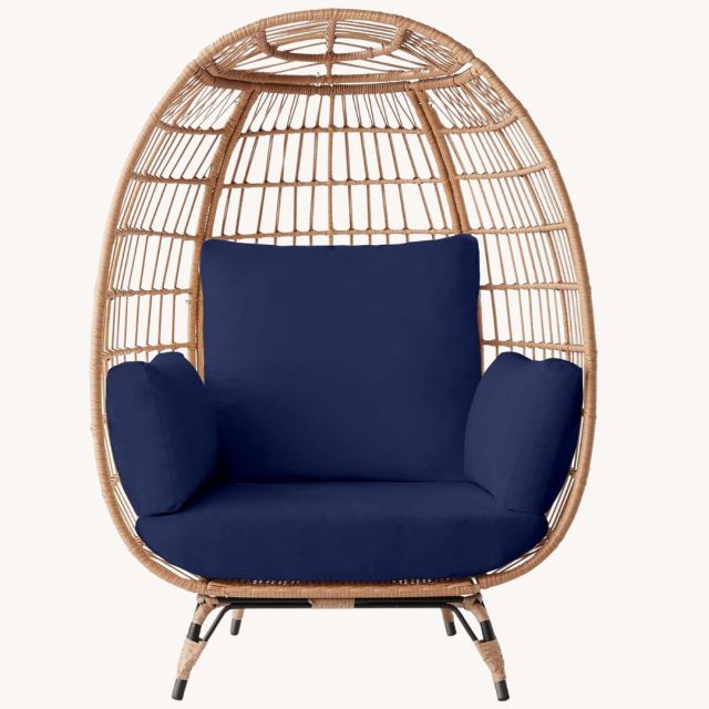 brown wicker egg chair with navy cushions