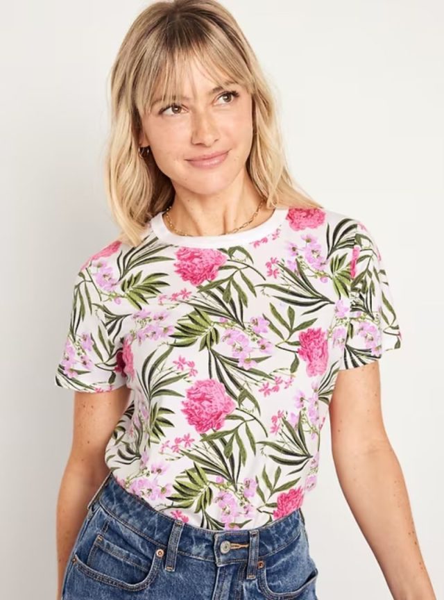 woman wearing floral t-shirt and jeans