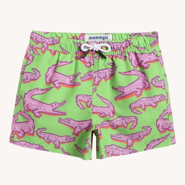 green swim trunks with pink alligators