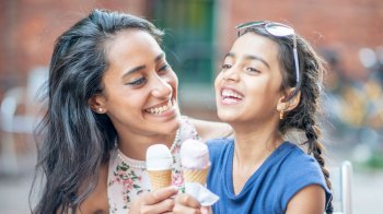 a picture of a mom and daughter eating ice cream, one of the most fun things to do in summer