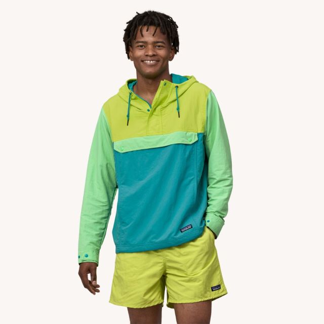 man wearing lime green shorts and matching pullover hoodie