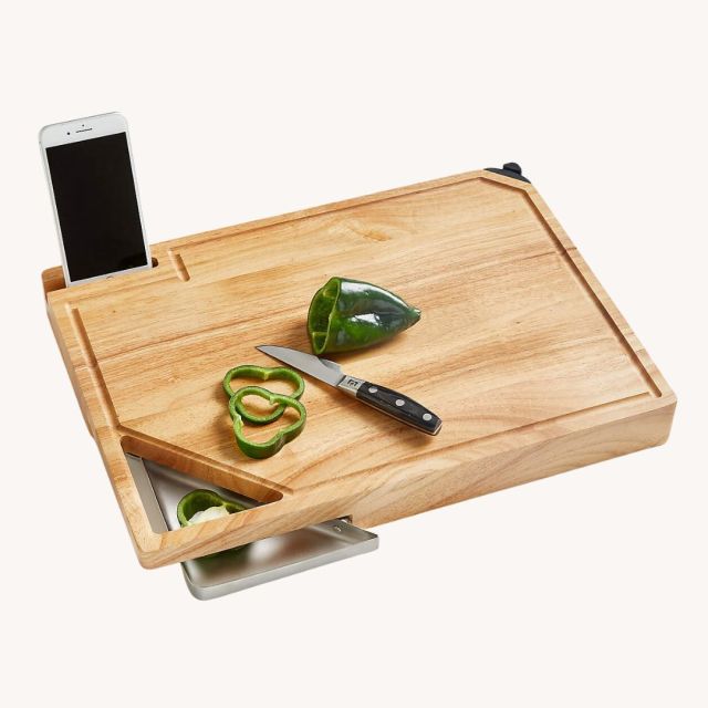 wooden cutting board with cell phone holder