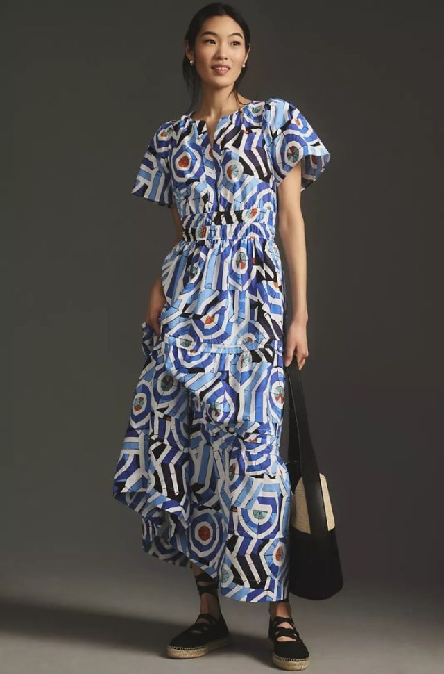 woman wearing blue printed maxi dress