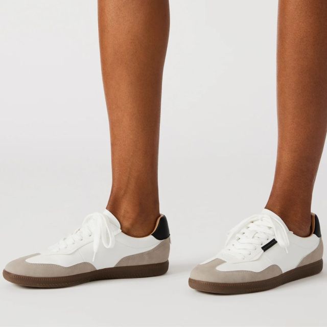 bottom of legs and white sneakers