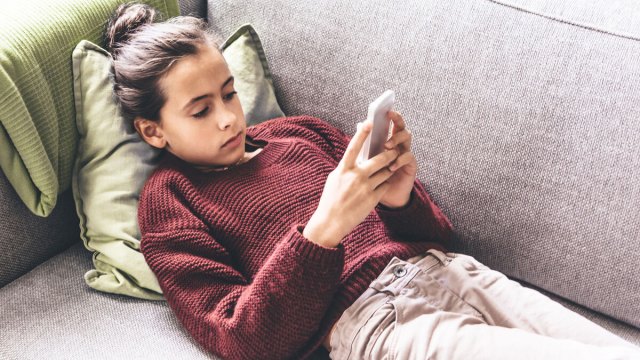 picture of a girl using screen time on her phone