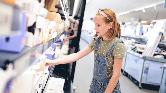 a girl in a store wondering when kids should start wearing deodorant
