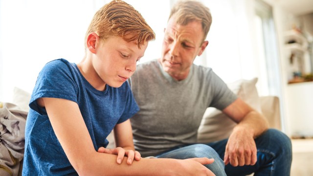 A father talking to his tween son who is engaging in negative self talk