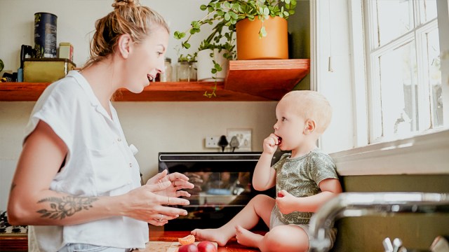 a mom talking to her baby who can hear her as part of their sensory development