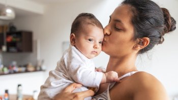 mom with her new baby, baby names 2025