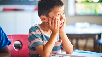 boy looking bored in class