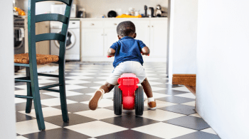 toddler riding away on ride on and not listening to parents