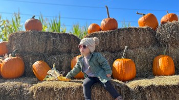 A baby at a pumpkin patch in Mt Hood Oregon, the place for fall family fun