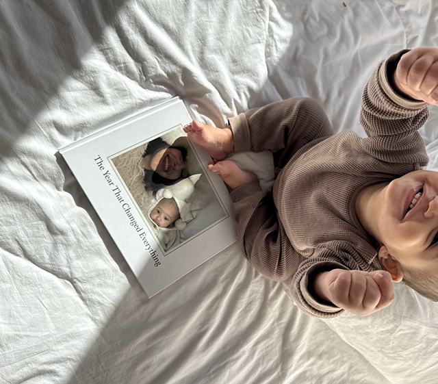 DJ MadBadTing's son in bed with her Tinybeans photo book